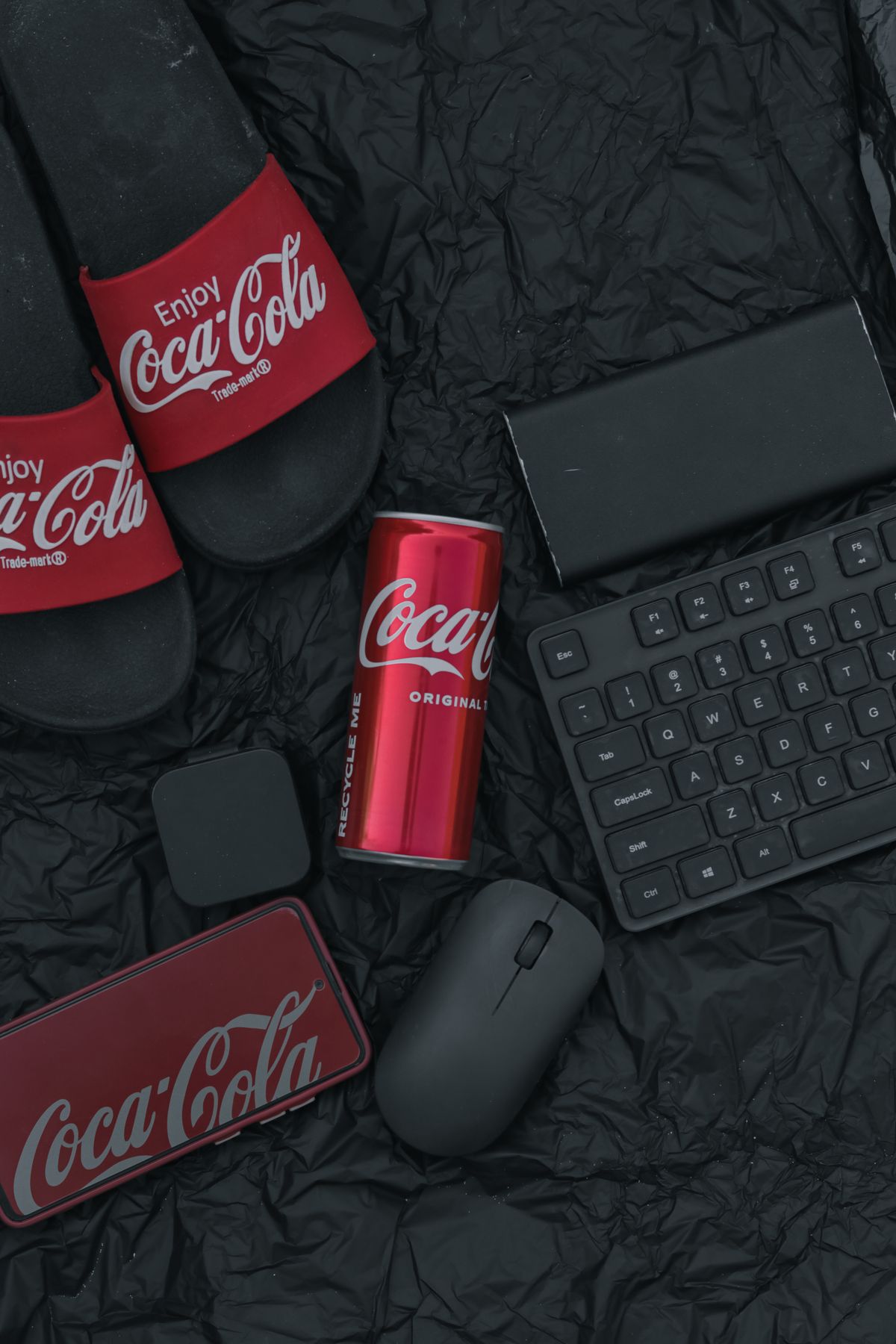 Branded merchandise and tech accessories flat lay