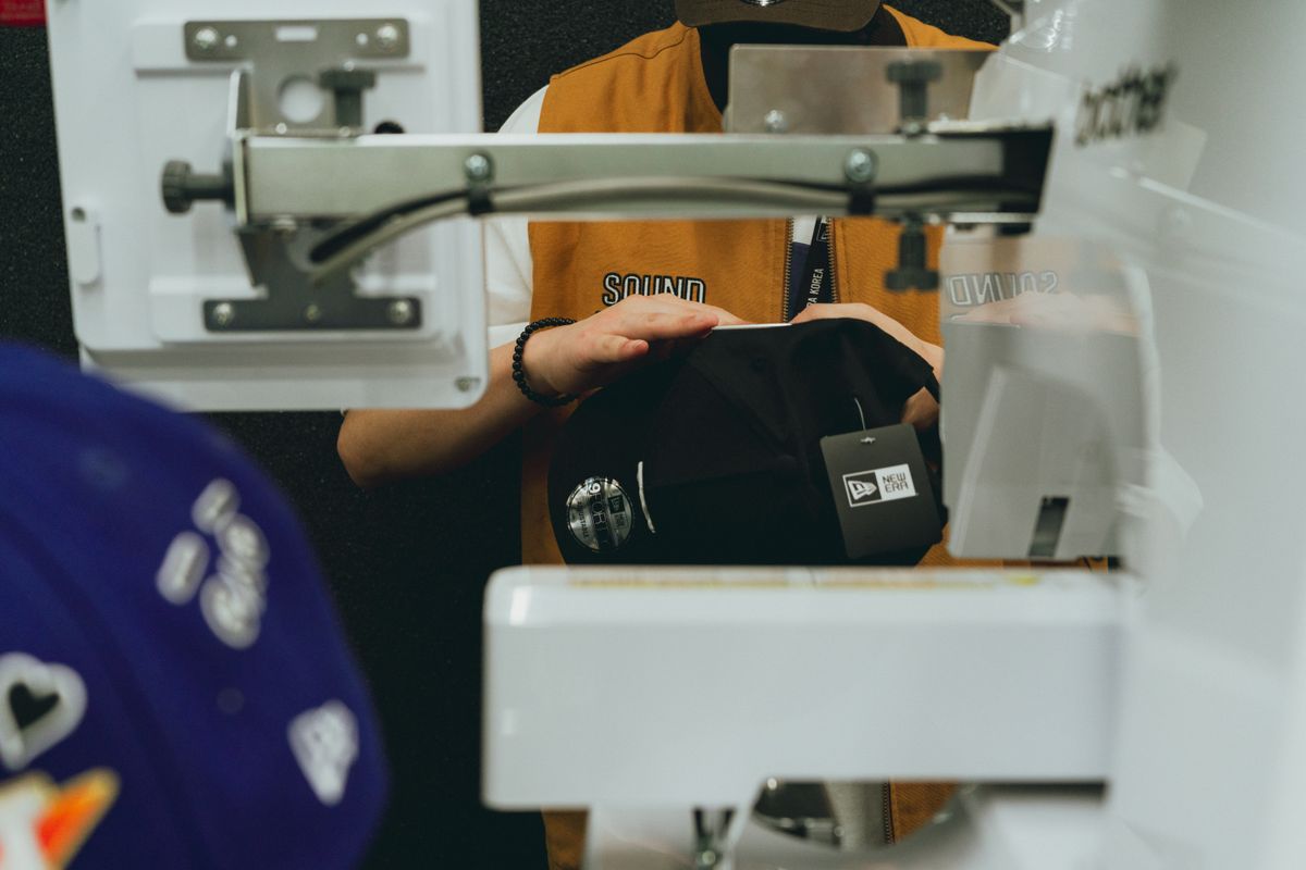 Custom hat embroidery in a shop