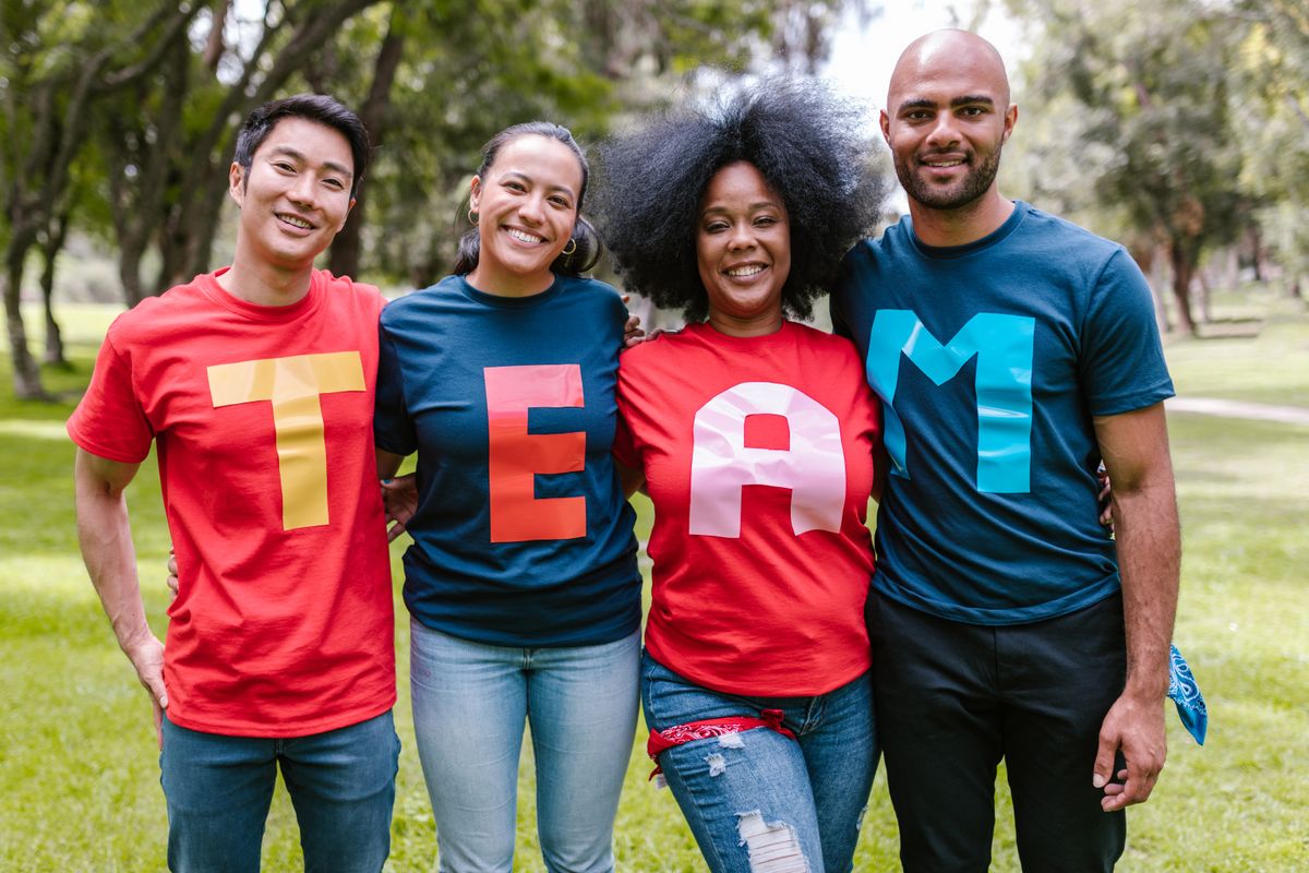 Team wearing branded shirts outdoors
